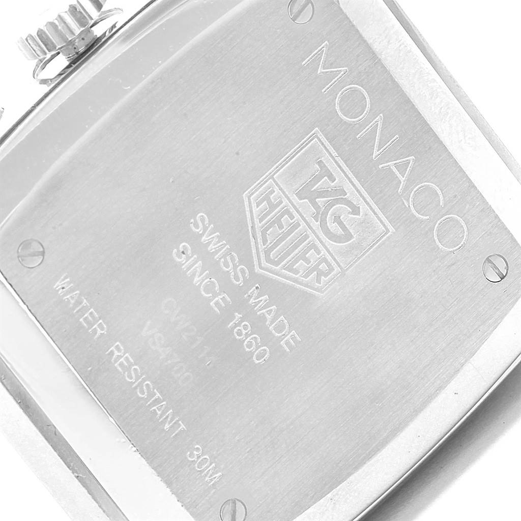 This image shows the back case of a Tag Heuer Monaco CW2114 Men
s Stainless Steel Brown Dial CW2114 Men
s Stainless Steel Brown Dial watch, highlighting the engraved details and screws.