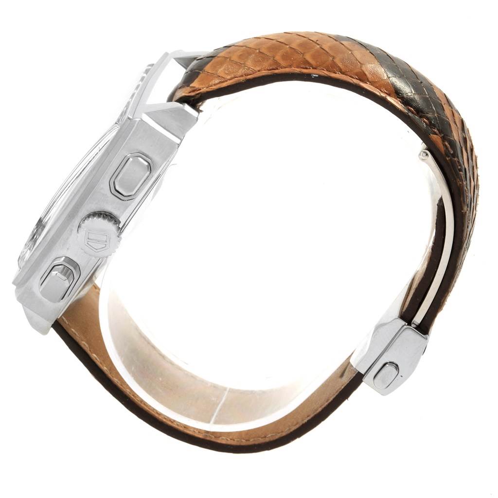 This image shows a side view of the Tag Heuer Monaco CW2114 Men
s Stainless Steel Brown Dial CW2114 Men
s Stainless Steel Brown Dial watch, highlighting the case, crown, and buttons along with the strap.
