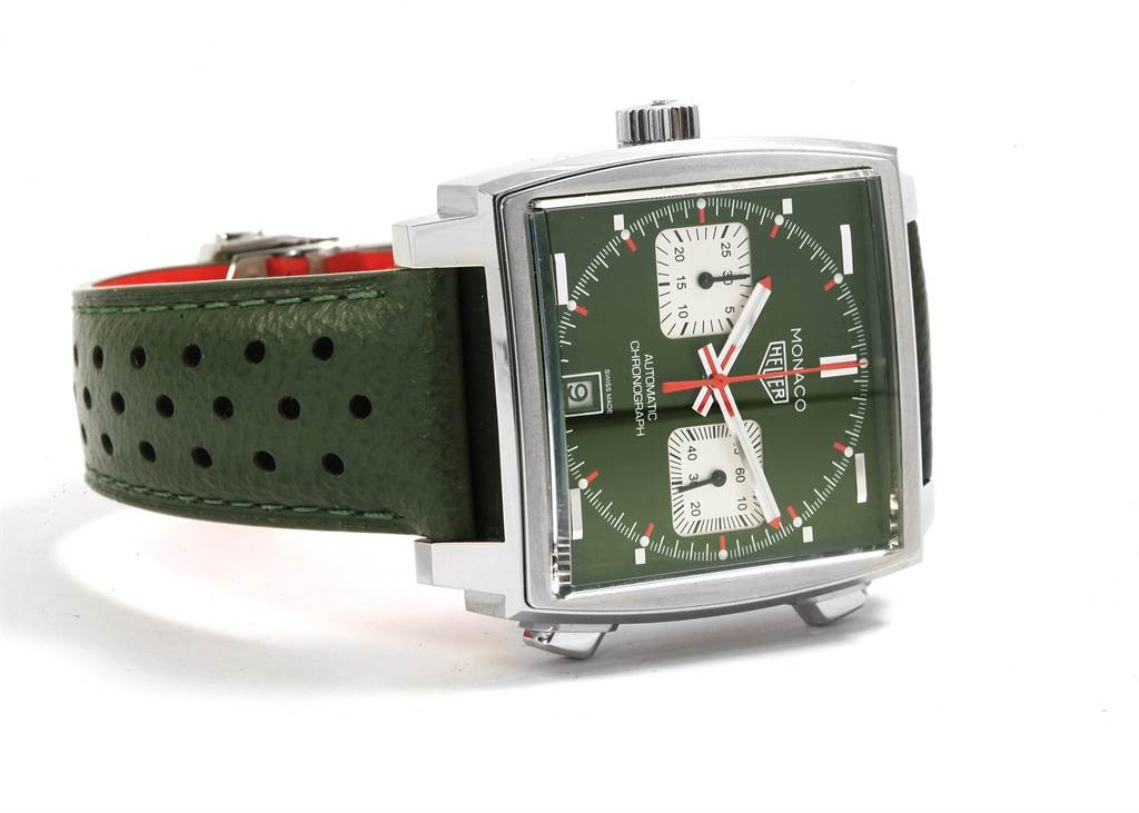 The image shows a green-faced Tag Heuer Monaco CAW211E.FC6414 Men's Stainless Steel Green Dial CAW211E.FC6414 Men's Stainless Steel Green Dial watch at an angle, highlighting the dial, case, and green perforated strap.