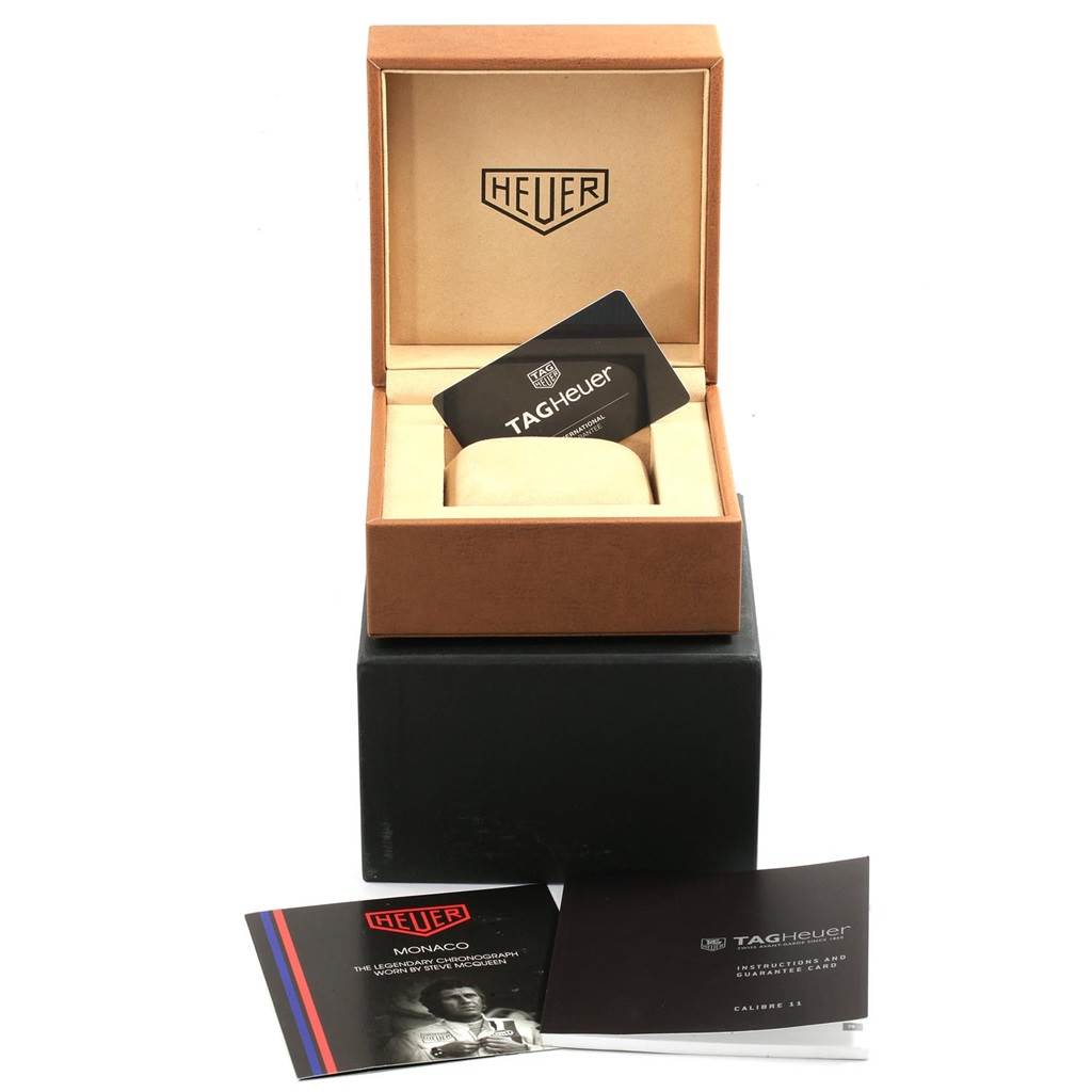 The image shows the packaging, documents, and warranty card for a Tag Heuer Monaco CAW211E.FC6414 Men's Stainless Steel Green Dial CAW211E.FC6414 Men's Stainless Steel Green Dial watch, with the watch box open.