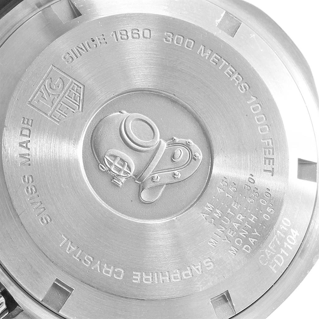 The image shows the back case of a Tag Heuer Aquaracer CAF7110.BA0803 Men
s Stainless Steel Blue Dial CAF7110.BA0803 Men
s Stainless Steel Blue Dial watch, highlighting the engraved logo and specifications.