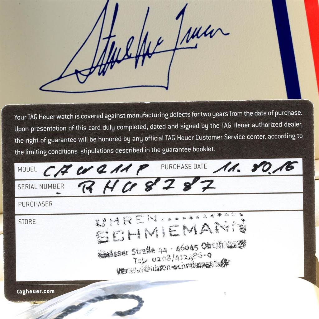 This image shows a warranty card for a Tag Heuer Monaco CAW211P Men's Stainless Steel Blue Dial CAW211P Men's Stainless Steel Blue Dial watch with handwritten model and purchase details.