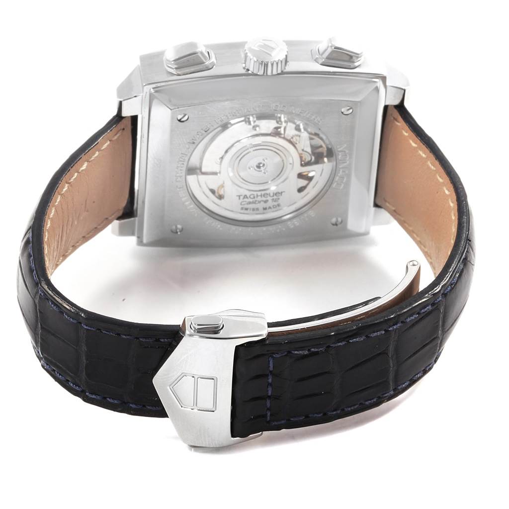 The image shows the back and strap of a Tag Heuer Monaco CAW2111 Men's Stainless Steel Blue Dial CAW2111 Men's Stainless Steel Blue Dial watch, highlighting its movement and leather band with clasp.