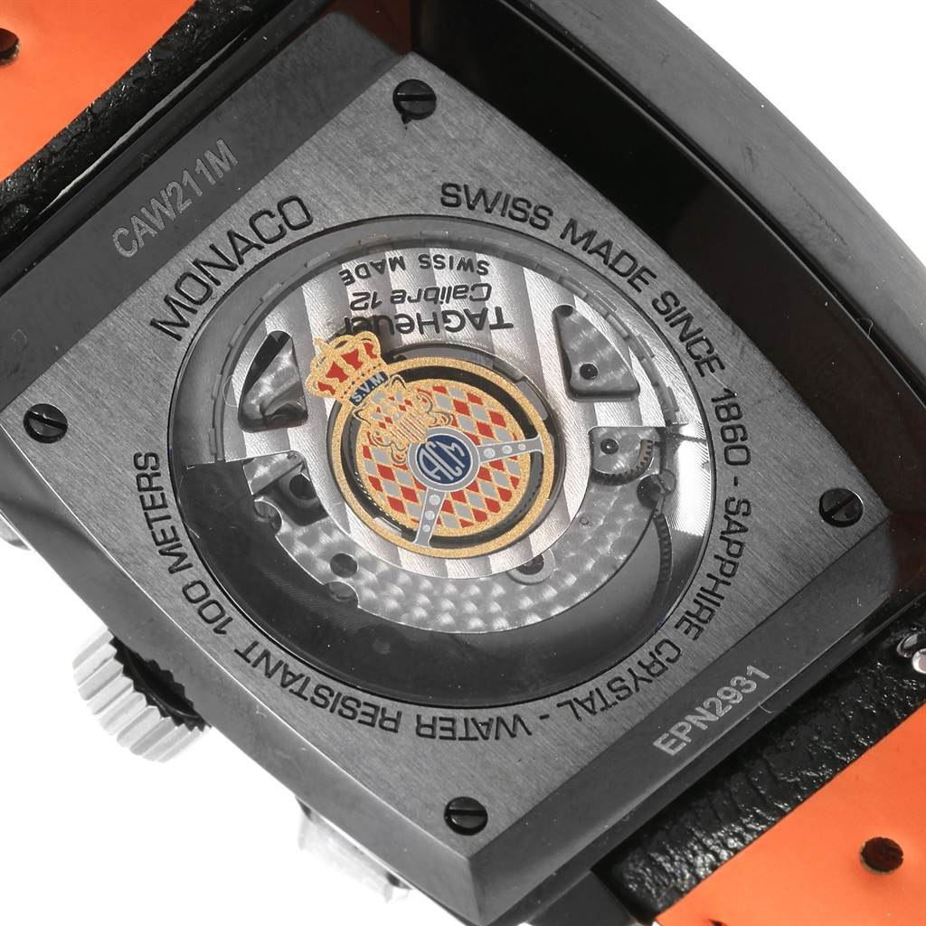 The image shows the back of a Tag Heuer Monaco CAW211M.FC6324 Men's Titanium Black Dial CAW211M.FC6324 Men's Titanium Black Dial watch, highlighting the movement and details etched on the case back.