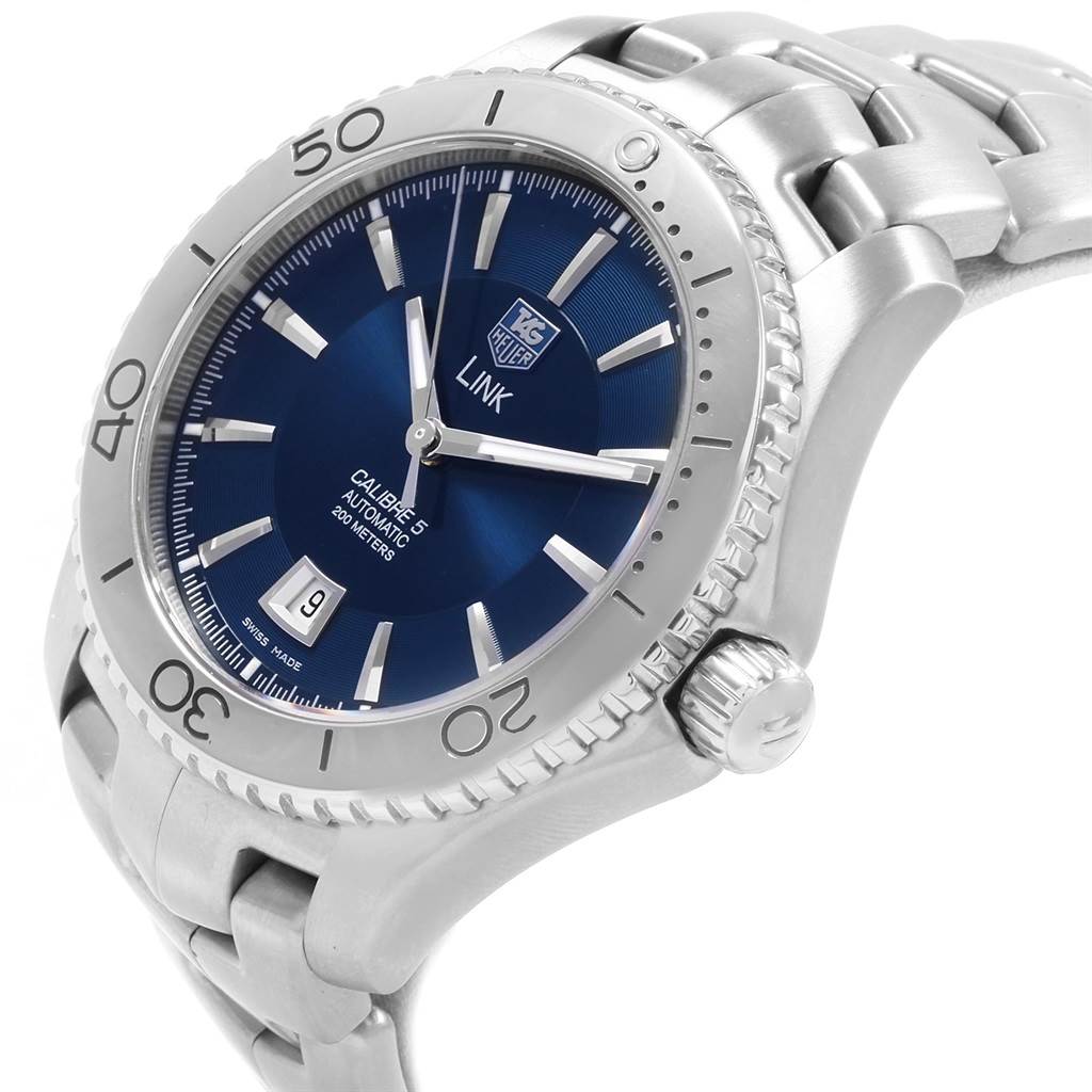The Tag Heuer Link WJ201C.BA0591 Men's Stainless Steel Blue Dial WJ201C.BA0591 Men's Stainless Steel Blue Dial watch is angled to show the face, bezel, crown, and a portion of the bracelet.