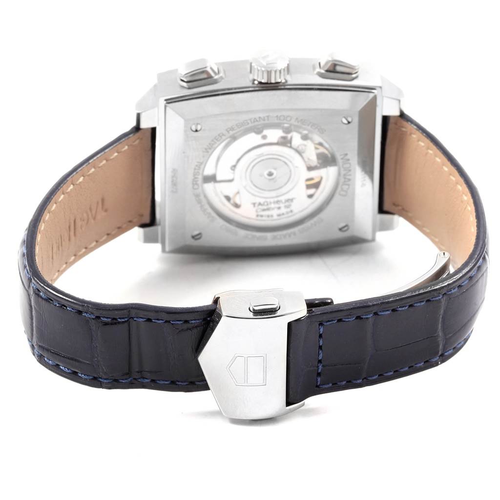 The image shows the back view of a Tag Heuer Monaco CAW2111 Men's Stainless Steel Blue Dial CAW2111 Men's Stainless Steel Blue Dial watch, focusing on the case back, movement, and leather strap.