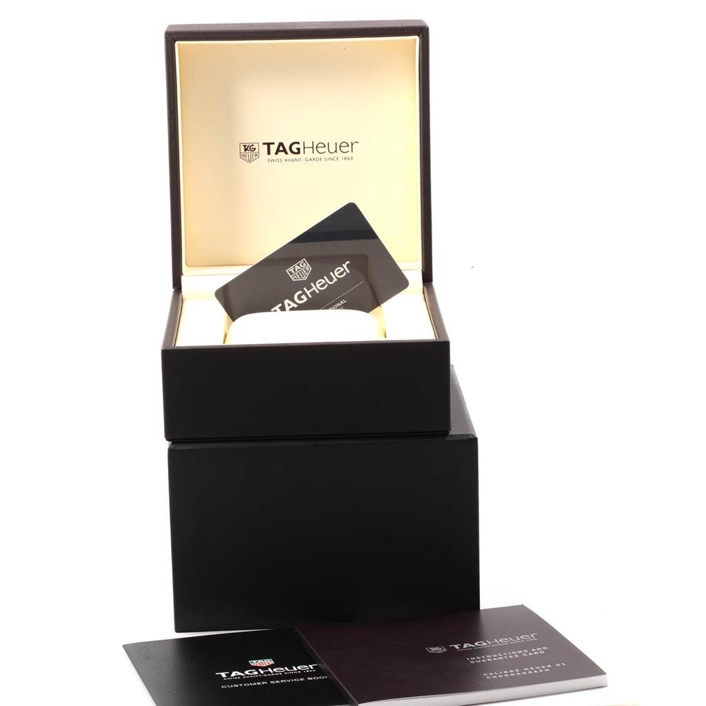 This image shows the open box, warranty card, and documents for a Tag Heuer Carrera CAR201V.BA0714 Men
s Stainless Steel Black Dial CAR201V.BA0714 Men
s Stainless Steel Black Dial model watch.