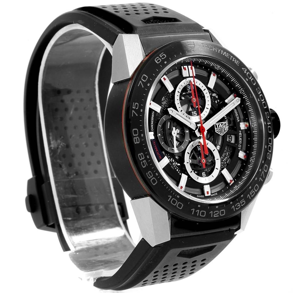 The Tag Heuer Carrera CAR2A1Z.FT6044 Men's Titanium Black Dial CAR2A1Z.FT6044 Men's Titanium Black Dial model watch is shown at a slight angle, displaying the face, bezel, and part of the perforated strap.