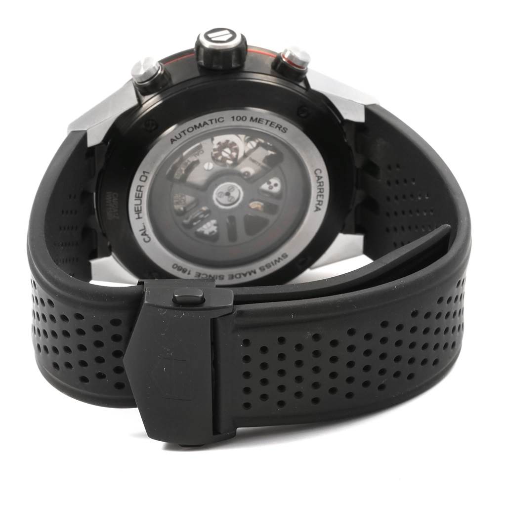 The image shows the back view of a Tag Heuer Carrera CAR2A1Z.FT6044 Men's Titanium Black Dial CAR2A1Z.FT6044 Men's Titanium Black Dial watch, highlighting its automatic movement and rubber strap.