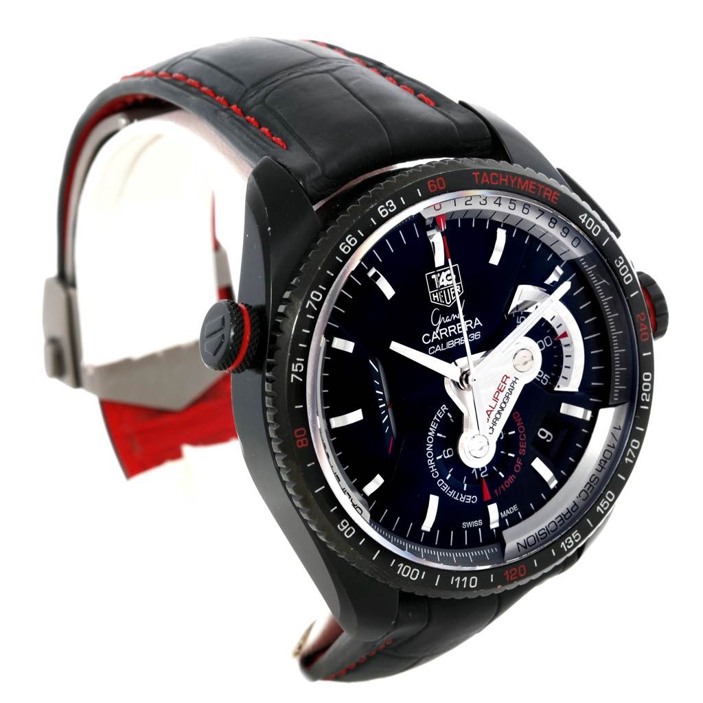 The image shows a Tag Heuer Carrera CAV5185.FC6237 Men's Titanium Black Dial CAV5185.FC6237 Men's Titanium Black Dial model watch from an angled side view, highlighting its black case, dial, and strap with red stitching.
