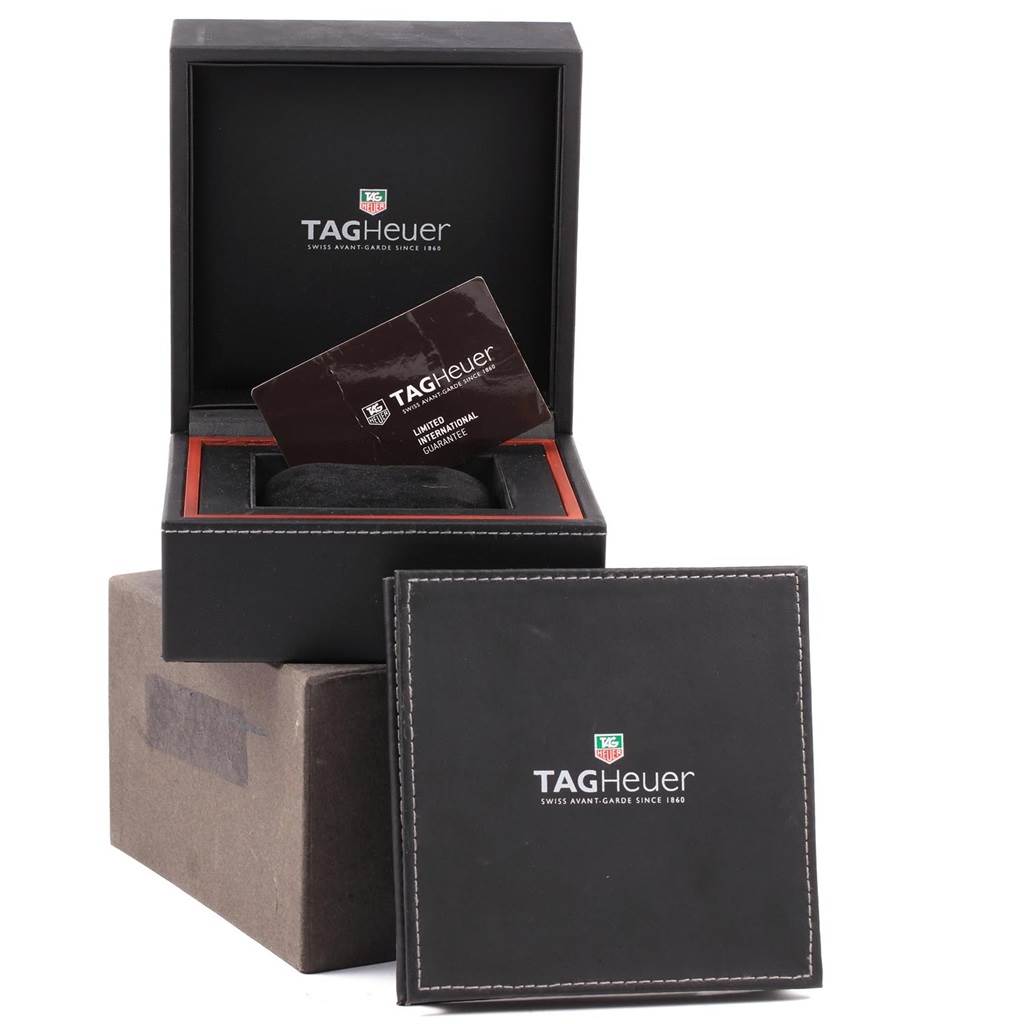 The image shows the packaging and warranty card for a Tag Heuer Carrera CAR2A1Z.FT6044 Men's Titanium Black Dial CAR2A1Z.FT6044 Men's Titanium Black Dial model watch, viewed from the front.