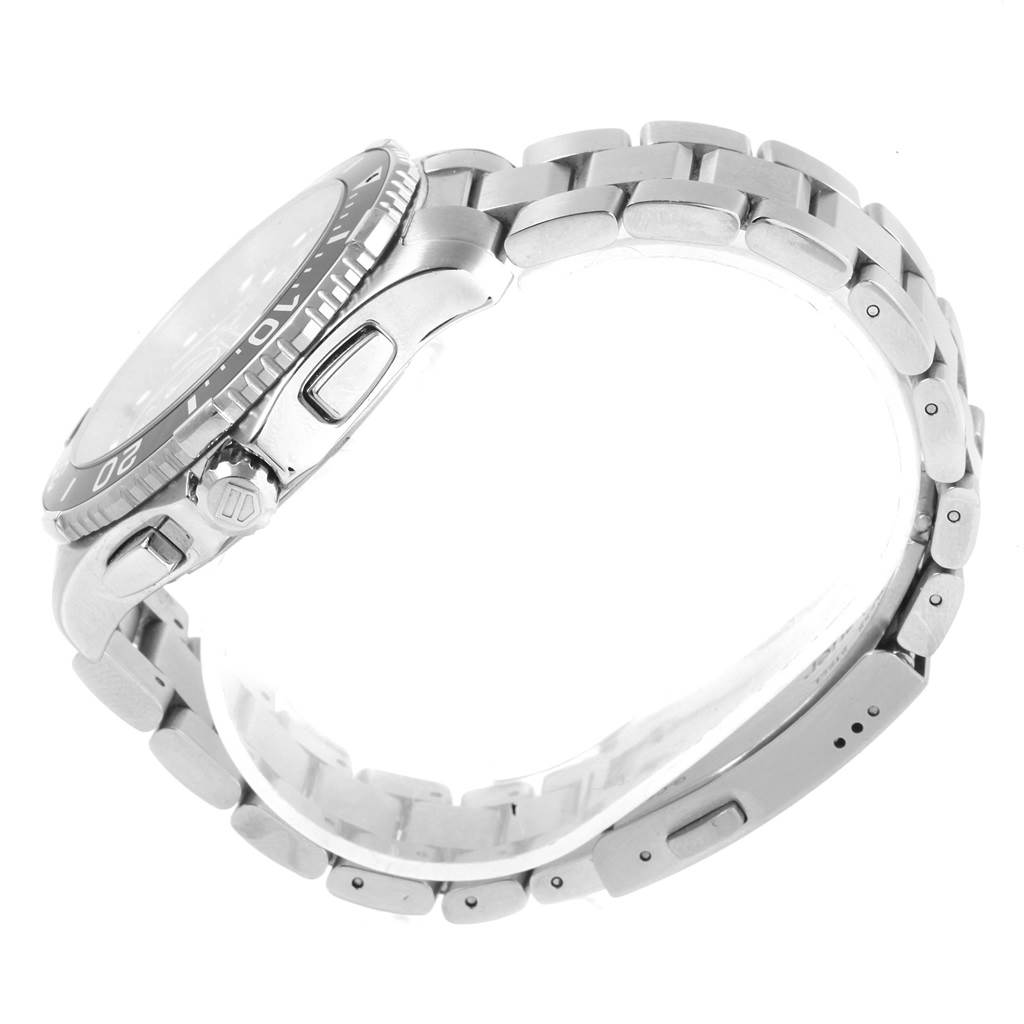 The image shows a side view of a Tag Heuer Aquaracer CAN1010.BA0821 Men's Stainless Steel Black Dial CAN1010.BA0821 Men's Stainless Steel Black Dial watch, highlighting the bezel, crown, and metal bracelet.