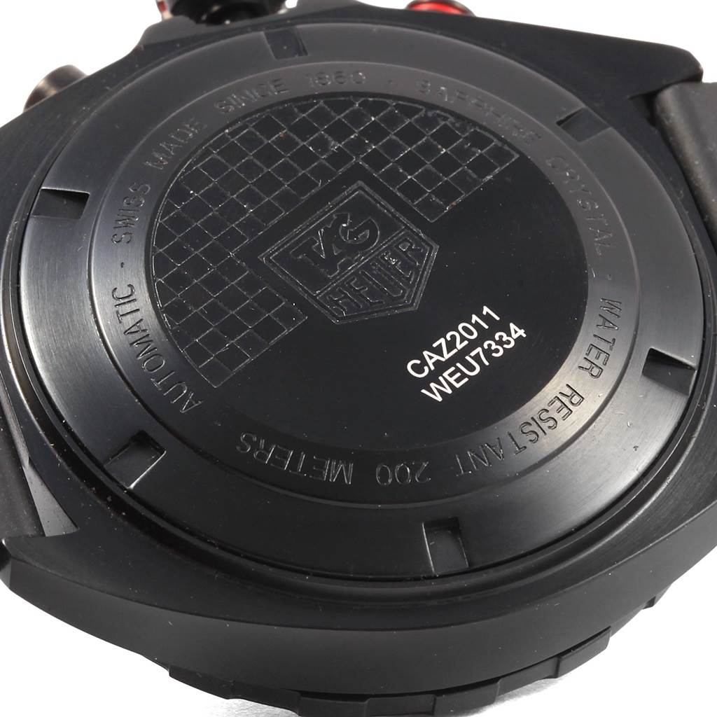 The image shows the back casing of a Tag Heuer Formula 1 CAZ2011.FT8024 Men's Titanium Black Dial CAZ2011.FT8024 Men's Titanium Black Dial watch, displaying model information and brand engraving.