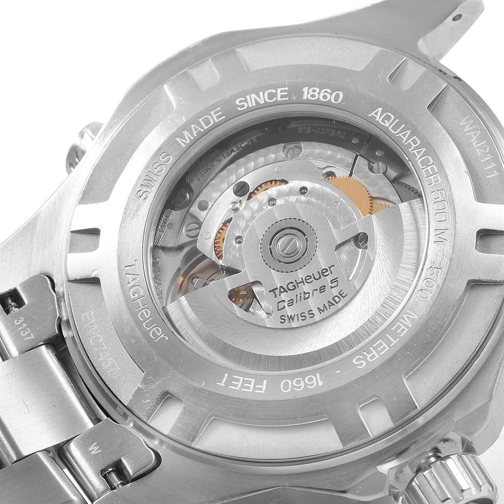 This image shows the back of a Tag Heuer Aquaracer WAJ2111 Men's Stainless Steel Grey Dial WAJ2111 Men's Stainless Steel Grey Dial watch, highlighting its automatic movement mechanism and inscriptions.