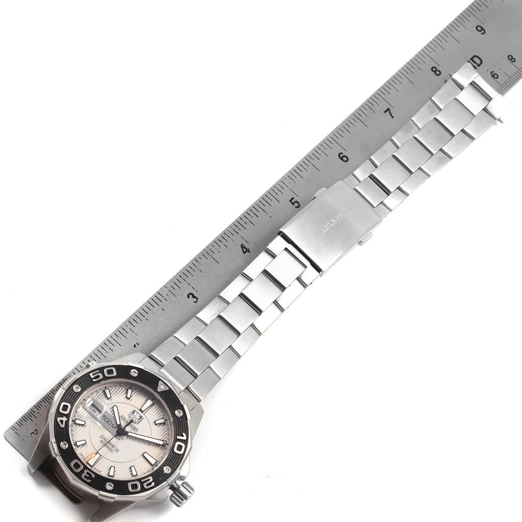 The image shows a Tag Heuer Aquaracer WAJ2111 Men's Stainless Steel Grey Dial WAJ2111 Men's Stainless Steel Grey Dial watch laid flat with a ruler for scale.