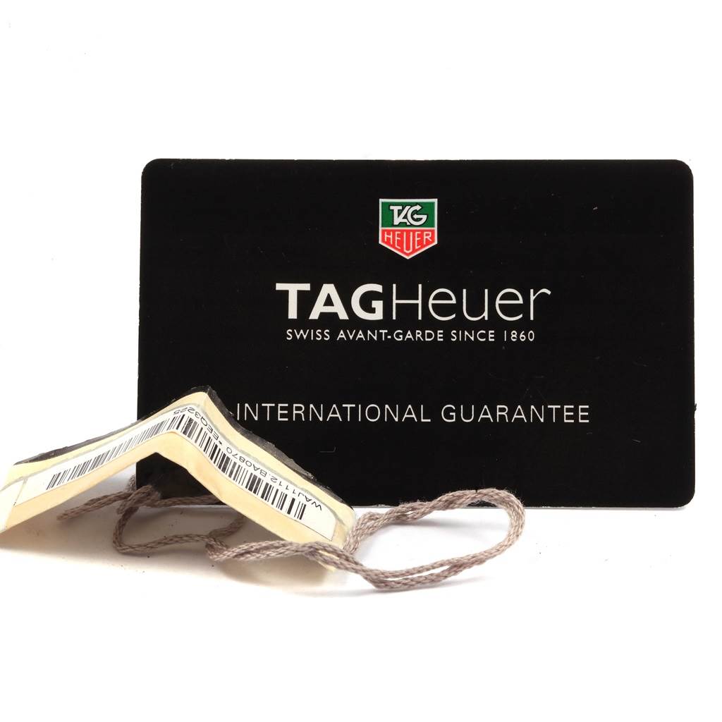 The image displays an international guarantee card and hang tag for a Tag Heuer Aquaracer WAJ1112.BA0871 Men's Stainless Steel Blue Dial WAJ1112.BA0871 Men's Stainless Steel Blue Dial watch.