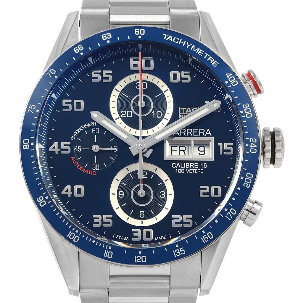 The image shows a close-up, front view of the Carrera chronograph watch by Tag Heuer, highlighting the dial, subdials, and tachymeter scale.