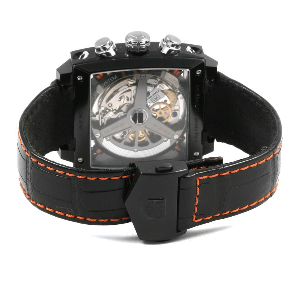 The image shows the back view of the Tag Heuer Limited Edition CAL5110.FC6265 Men's Titanium Black Dial CAL5110.FC6265 Men's Titanium Black Dial model, highlighting the movement and leather strap with orange stitching.