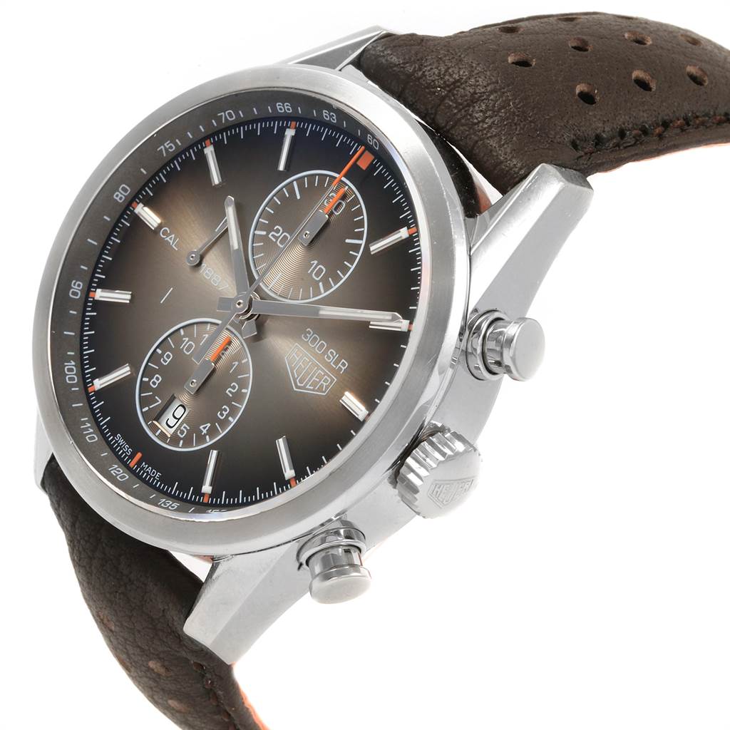 The image shows a close-up, angled view of the Tag Heuer SLR CAR2112.FC6267 Men's Stainless Steel Brown Dial CAR2112.FC6267 Men's Stainless Steel Brown Dial watch, featuring its dial, chronograph, and leather strap.