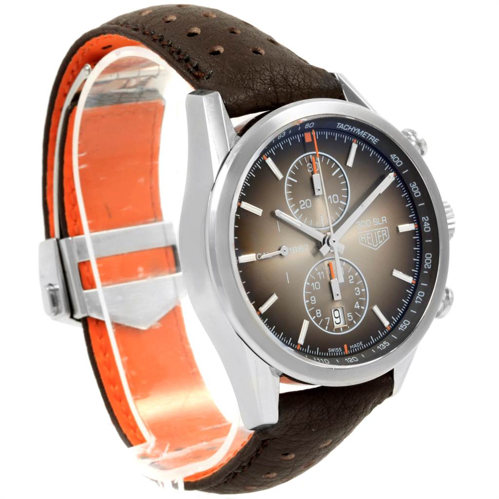The image displays a Tag Heuer SLR CAR2112.FC6267 Men's Stainless Steel Brown Dial CAR2112.FC6267 Men's Stainless Steel Brown Dial model watch from a side angle, highlighting its dial, case, and leather strap.