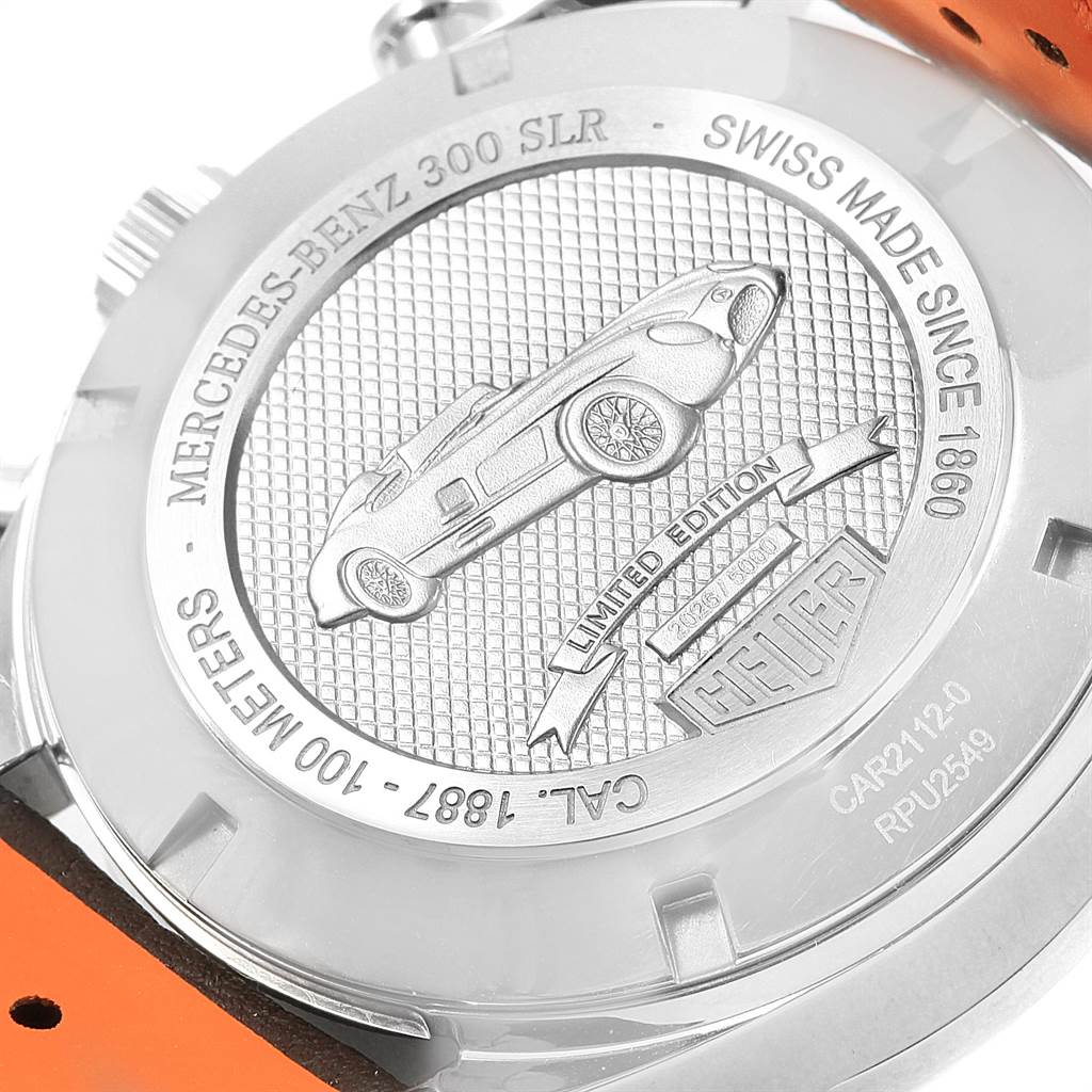 The image shows the back of the Tag Heuer SLR CAR2112.FC6267 Men's Stainless Steel Brown Dial CAR2112.FC6267 Men's Stainless Steel Brown Dial watch, featuring an engraving of a car and various inscriptions.