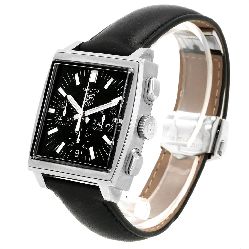 The Tag Heuer Monaco CW2111 Men
s Stainless Steel Black Dial CW2111 Men
s Stainless Steel Black Dial watch is shown at a three-quarter angle, highlighting its square dial, chronograph buttons, and black leather strap.
