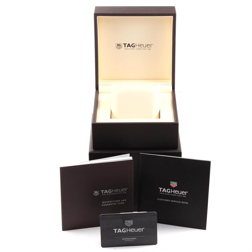 This image shows the packaging and documents for a Tag Heuer Aquaracer WAJ1113.FT6015 Men's Stainless Steel Orange Dial WAJ1113.FT6015 Men's Stainless Steel Orange Dial watch, including the box, instruction manual, service book, and warranty card.