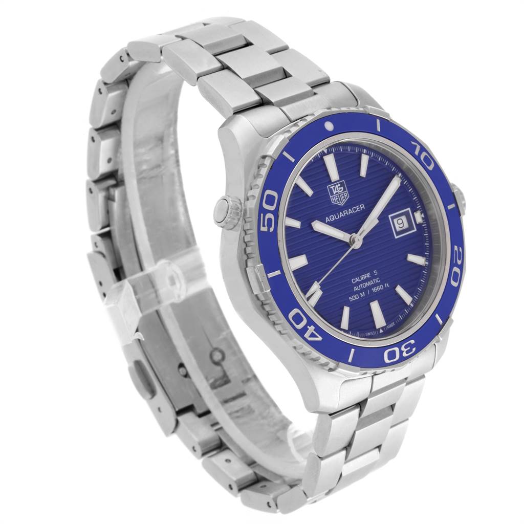 The image shows a Tag Heuer Aquaracer WAK2111.BA0830 Men's Stainless Steel Blue Dial WAK2111.BA0830 Men's Stainless Steel Blue Dial watch angled to display its blue dial, bezel, and silver metal band.