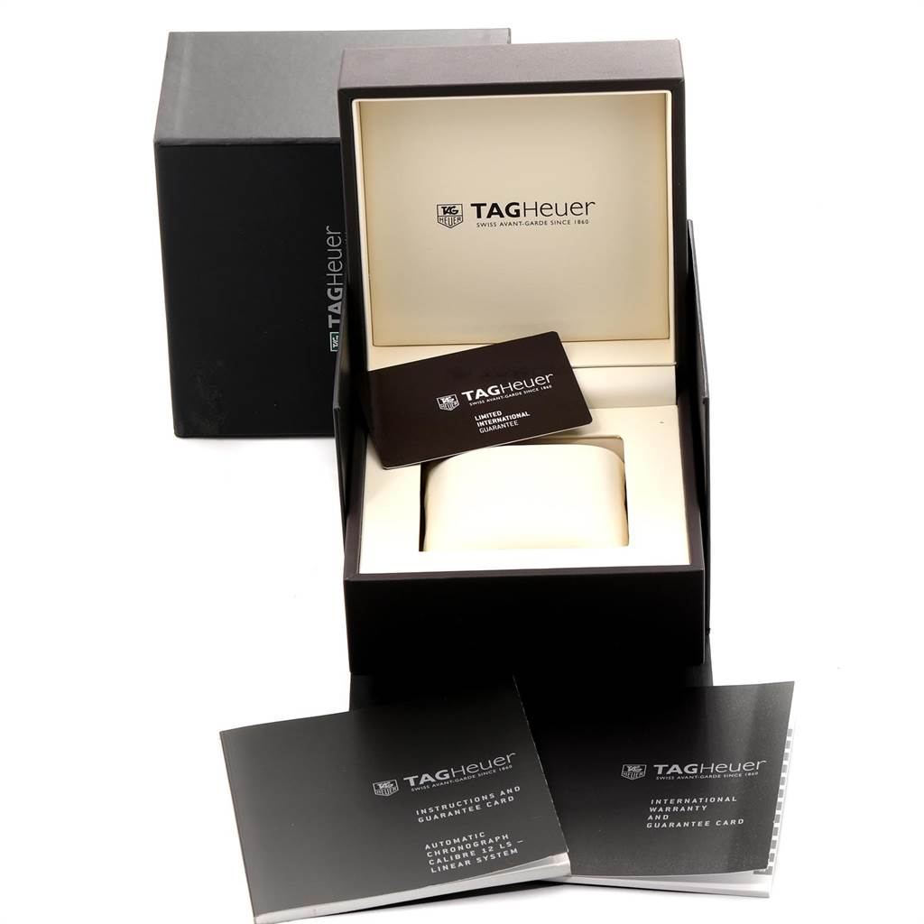 The image shows the packaging and accessories for the Tag Heuer Monaco CAL2110.BA0781 Men's Stainless Steel Black Dial CAL2110.BA0781 Men's Stainless Steel Black Dial model, including the box, cushion, and guarantee card.