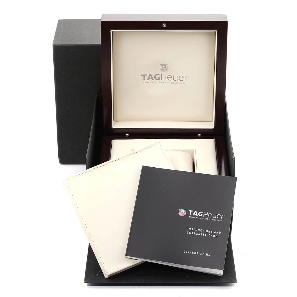 The image shows the open box of a Limited Edition Tag Heuer watch, revealing its packaging and instruction manual.