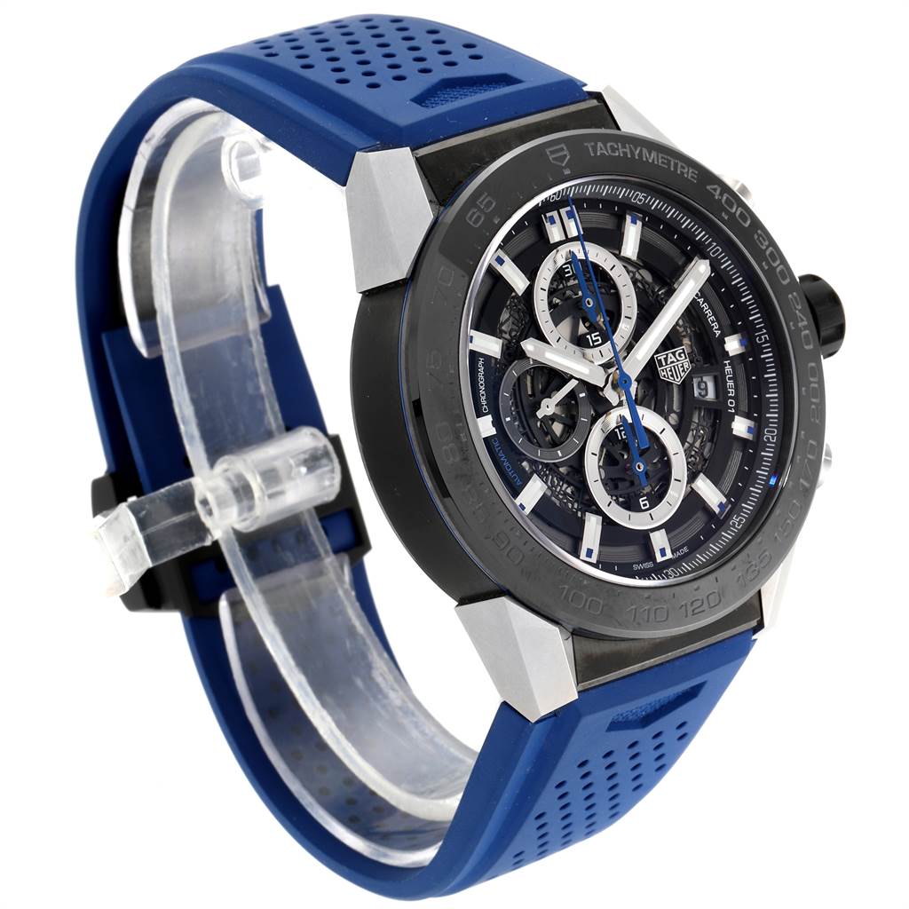 The Tag Heuer Carrera CAR2A1T.FT6052 Men's Titanium Black Dial CAR2A1T.FT6052 Men's Titanium Black Dial watch is shown at an angled view, highlighting its blue strap, tachymeter bezel, and detailed chronograph dial.