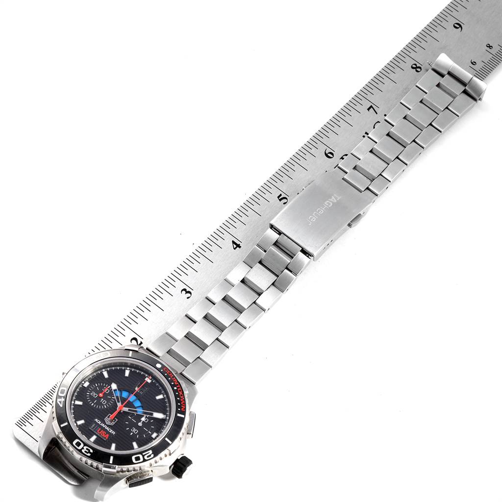 The image shows a Tag Heuer Aquaracer CAK211B.BA0833 Men's Stainless Steel Black Dial CAK211B.BA0833 Men's Stainless Steel Black Dial watch face and metal bracelet measured against a ruler from a top-down angle.