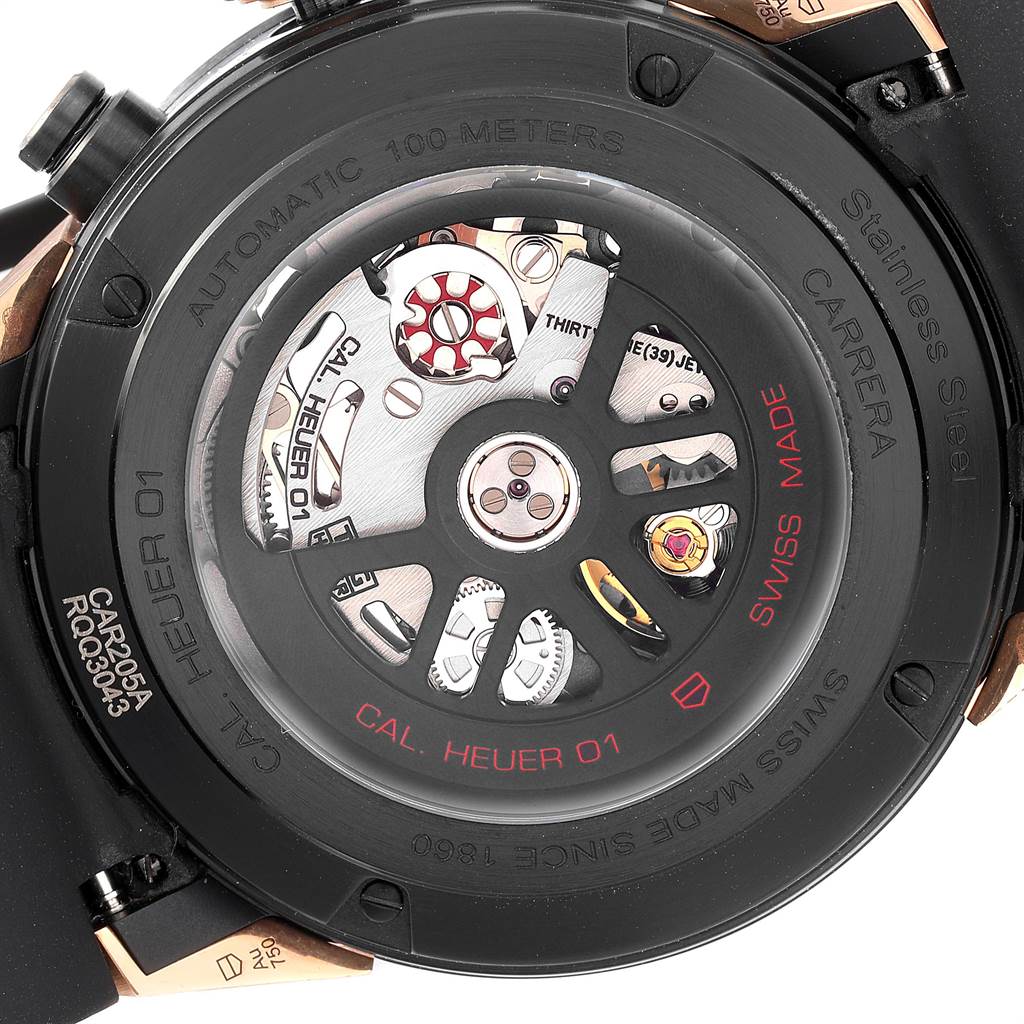 The image shows the back view of a Tag Heuer Carrera CAR205A.FT6087 Men's Titanium Black Dial CAR205A.FT6087 Men's Titanium Black Dial watch, revealing the Cal. Heuer 01 automatic movement.
