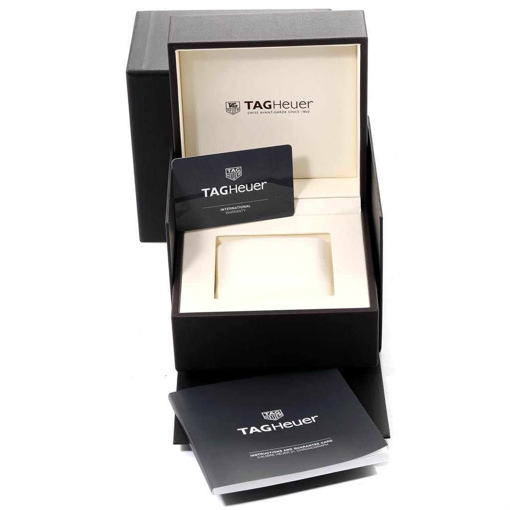 This image shows the open packaging, warranty card, and manual for the Tag Heuer Carrera CAR205A.FT6087 Men's Titanium Black Dial CAR205A.FT6087 Men's Titanium Black Dial model watch.