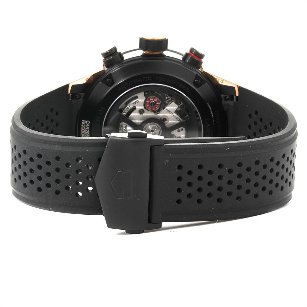 The image shows the back view of a Tag Heuer Carrera CAR205A.FT6087 Men's Titanium Black Dial CAR205A.FT6087 Men's Titanium Black Dial watch, highlighting its case back and perforated black strap.