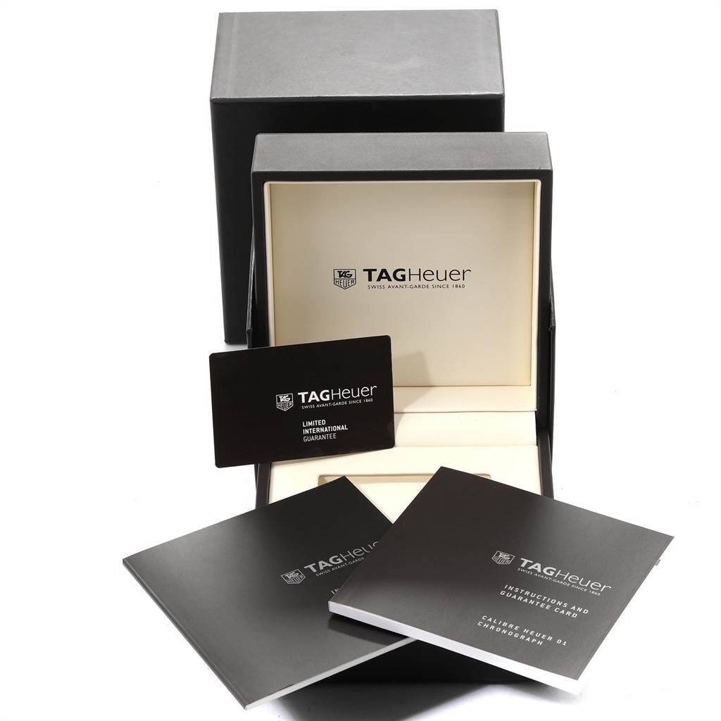 The image shows the box, an instruction manual, and a limited international guarantee card for the Tag Heuer Carrera CAR2A1Z.FT6051 Men's Titanium Black Dial CAR2A1Z.FT6051 Men's Titanium Black Dial watch.