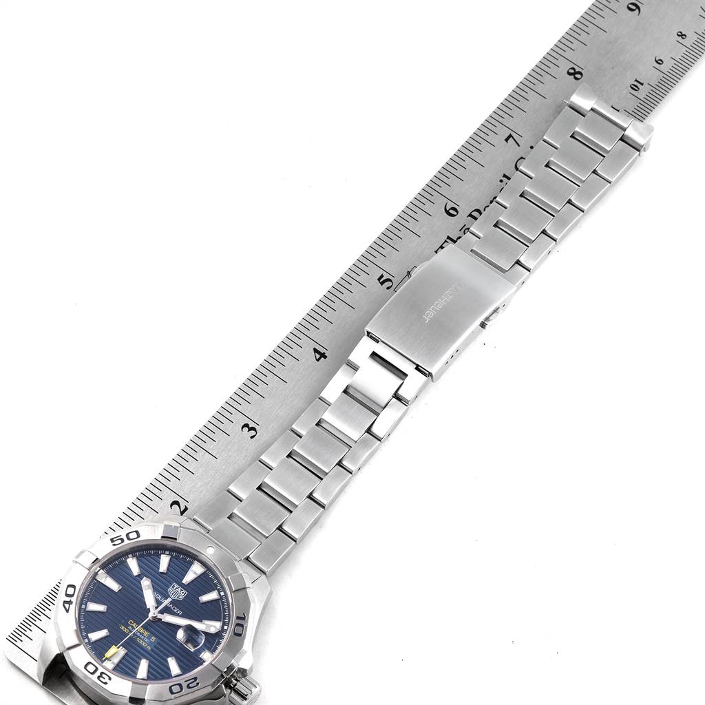 The image shows the Tag Heuer Aquaracer WAY2012.BA0927 Men's Stainless Steel Blue Dial WAY2012.BA0927 Men's Stainless Steel Blue Dial watch from a top-down angle, displaying the face, bracelet, and clasp alongside a ruler.