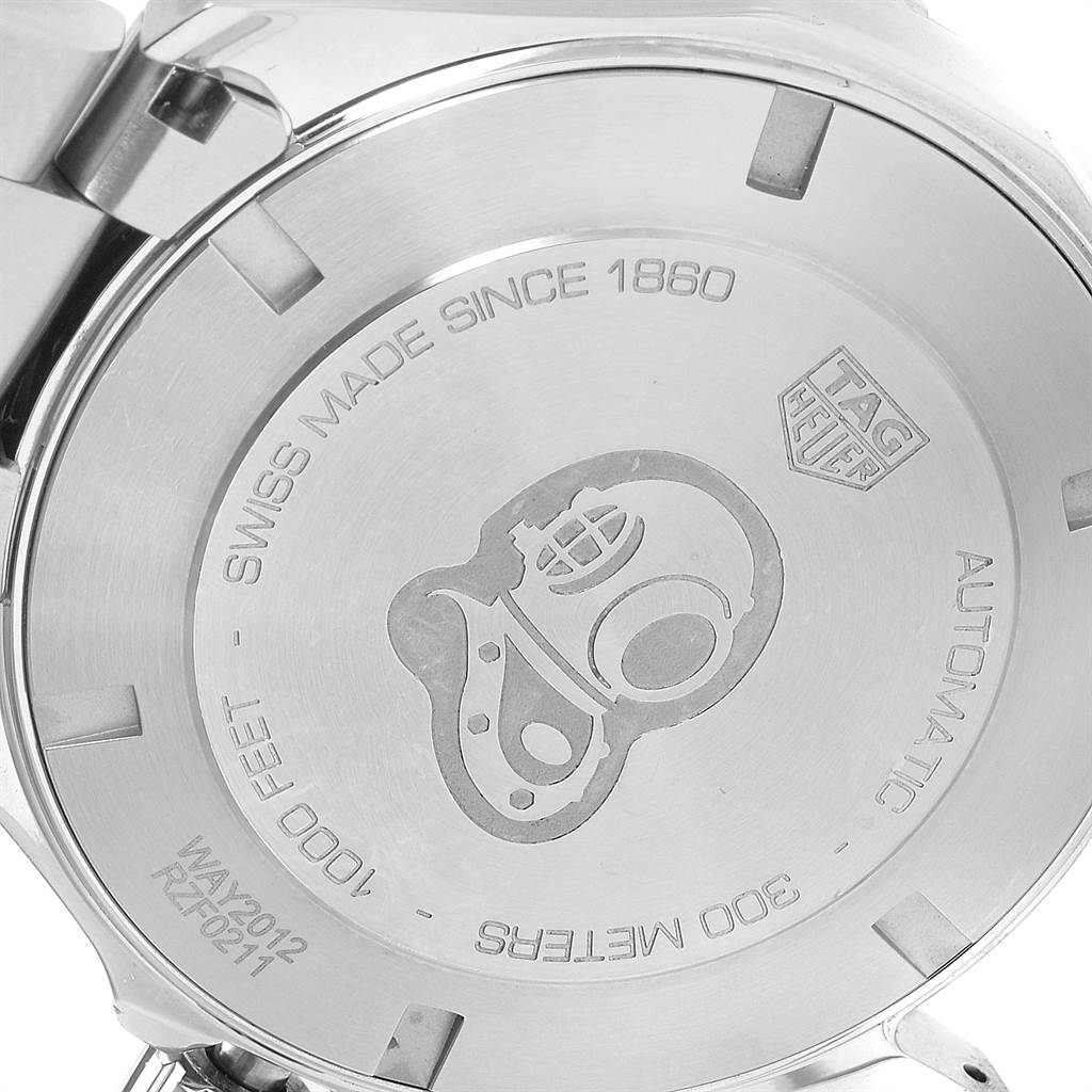 The image shows the case back of a Tag Heuer Aquaracer WAY2012.BA0927 Men's Stainless Steel Blue Dial WAY2012.BA0927 Men's Stainless Steel Blue Dial watch with engravings of specifications and a diving helmet design.