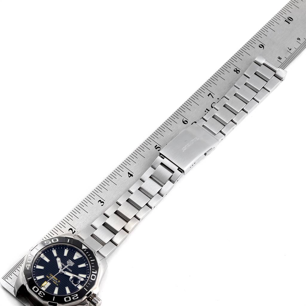 The image shows a Tag Heuer Aquaracer WAY201A.BA0927 Men's Stainless Steel Black Dial WAY201A.BA0927 Men's Stainless Steel Black Dial watch laid flat next to a ruler, highlighting the full length of its metal bracelet.