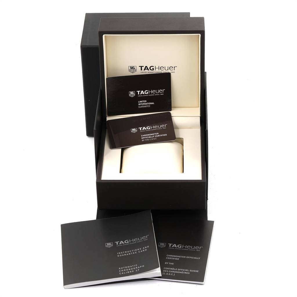 The image shows the packaging and documents for a Tag Heuer Carrera CV5111.FC6335 Men's Stainless Steel Silver Dial CV5111.FC6335 Men's Stainless Steel Silver Dial watch, including guarantee cards and instruction manuals.