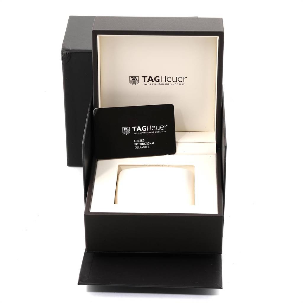 The image shows a Tag Heuer Carrera CAR2A1Z.FT6044 Men's Titanium Black Dial CAR2A1Z.FT6044 Men's Titanium Black Dial watch box and a limited international guarantee card at an angle revealing the interior.