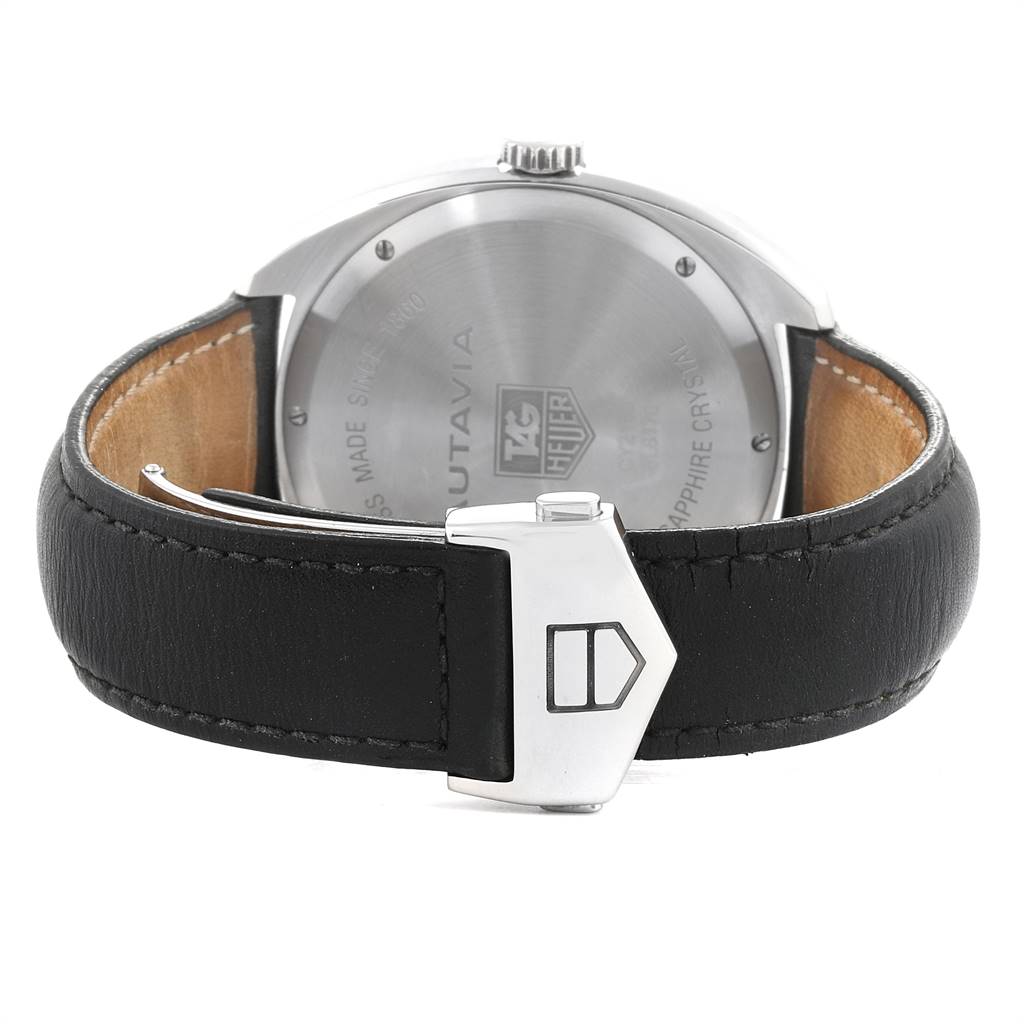 The image shows the back view of a Tag Heuer Autavia CY2110 Men's Stainless Steel White Dial CY2110 Men's Stainless Steel White Dial watch, focusing on the case back and black leather strap with a clasp.