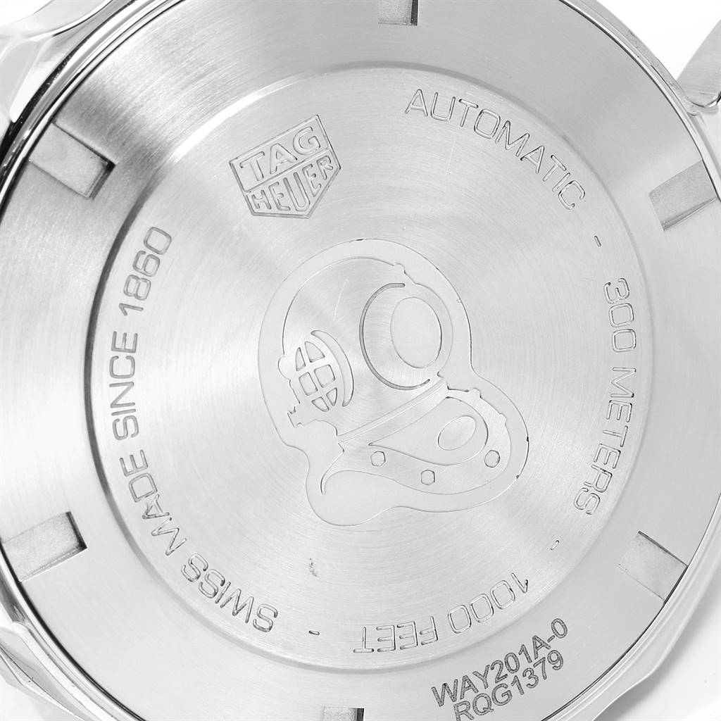 The image shows the case back of a Tag Heuer Aquaracer WAY201A.BA0927 Men's Stainless Steel Black Dial WAY201A.BA0927 Men's Stainless Steel Black Dial watch, featuring engravings and a diver's helmet design.