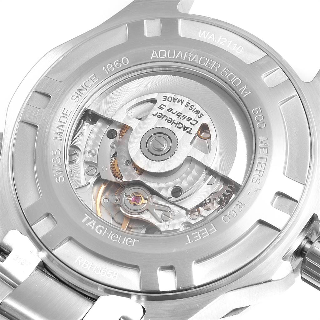 The image shows the back view of the Tag Heuer Aquaracer WAJ2110.BA0870 Men's Stainless Steel Black Dial WAJ2110.BA0870 Men's Stainless Steel Black Dial watch, highlighting the inner mechanical movement and engraving details.