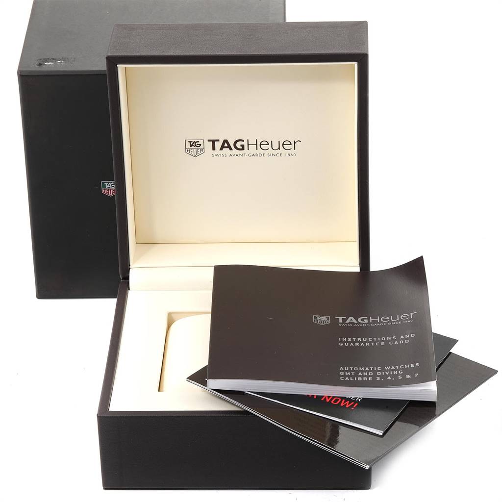 The image shows an open Tag Heuer Carrera CAV518B.FC6237 Men's Titanium Black Dial CAV518B.FC6237 Men's Titanium Black Dial watch box with instruction booklets and guarantee cards.