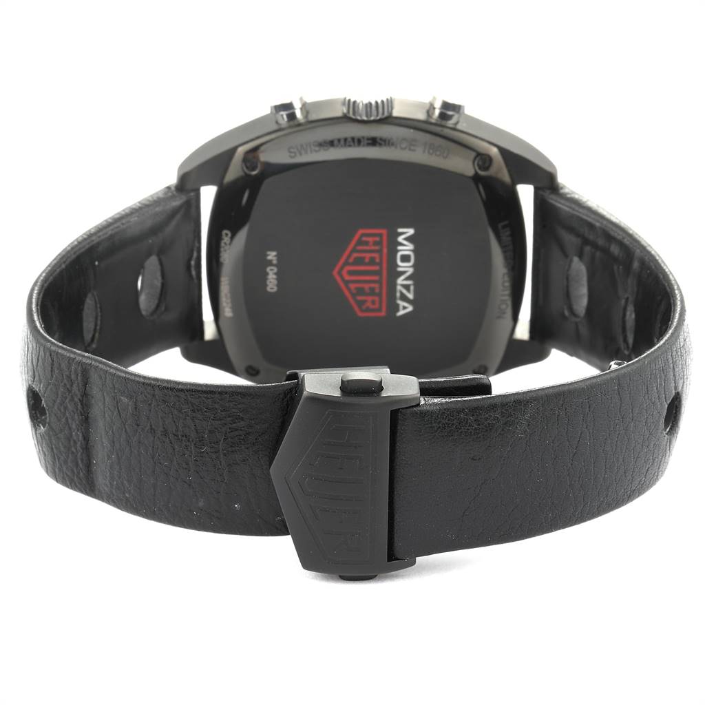 The image shows the back of a Tag Heuer Monza CR2080.FC6375 Men
s Titanium Black Dial CR2080.FC6375 Men
s Titanium Black Dial watch, highlighting the case back and leather strap with a clasp.