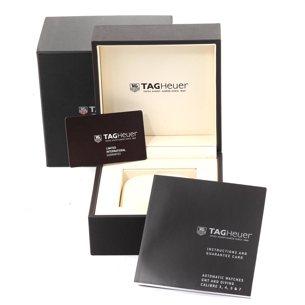 The image shows an open Tag Heuer Aquaracer WAY211A Men
s Stainless Steel Black Dial WAY211A Men
s Stainless Steel Black Dial watch box, its manual, and guarantee card, viewed from a front angle.