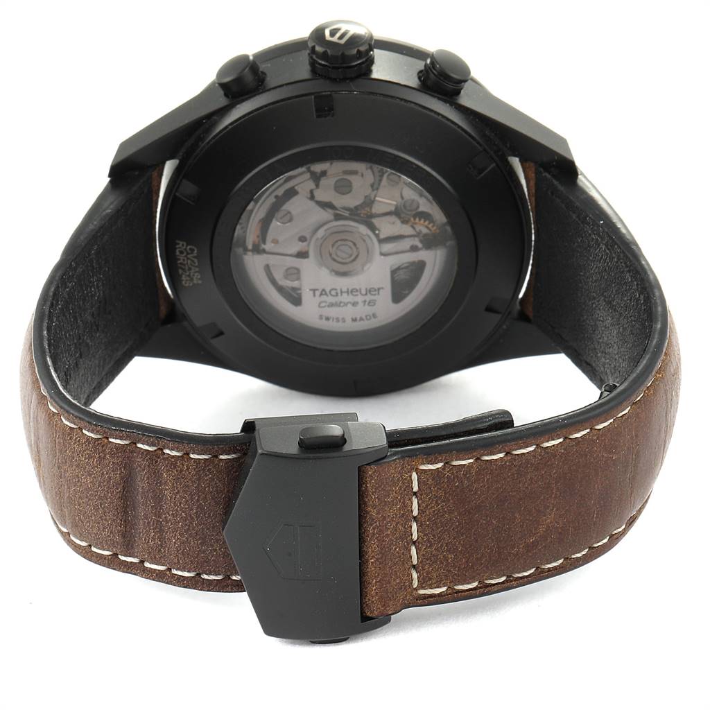 This image shows the back view of a Tag Heuer Carrera CV2A84.FC6394 Men's Titanium Black Dial CV2A84.FC6394 Men's Titanium Black Dial watch with its movement visible and a brown leather strap with buckle.