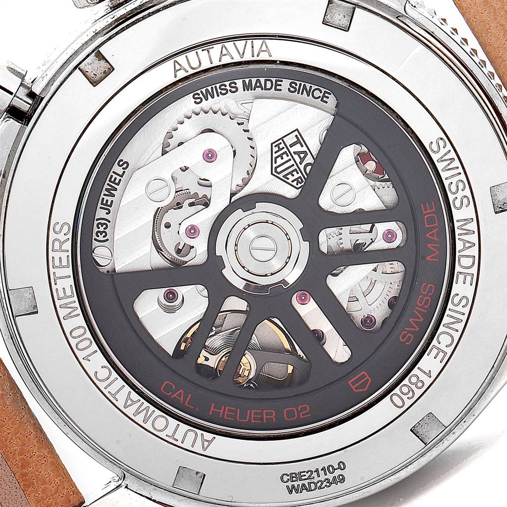 The image shows the back of the Tag Heuer Autavia CBE2110.FC8226 Men's Stainless Steel Black Dial CBE2110.FC8226 Men's Stainless Steel Black Dial watch, highlighting its automatic movement and intricate mechanisms.