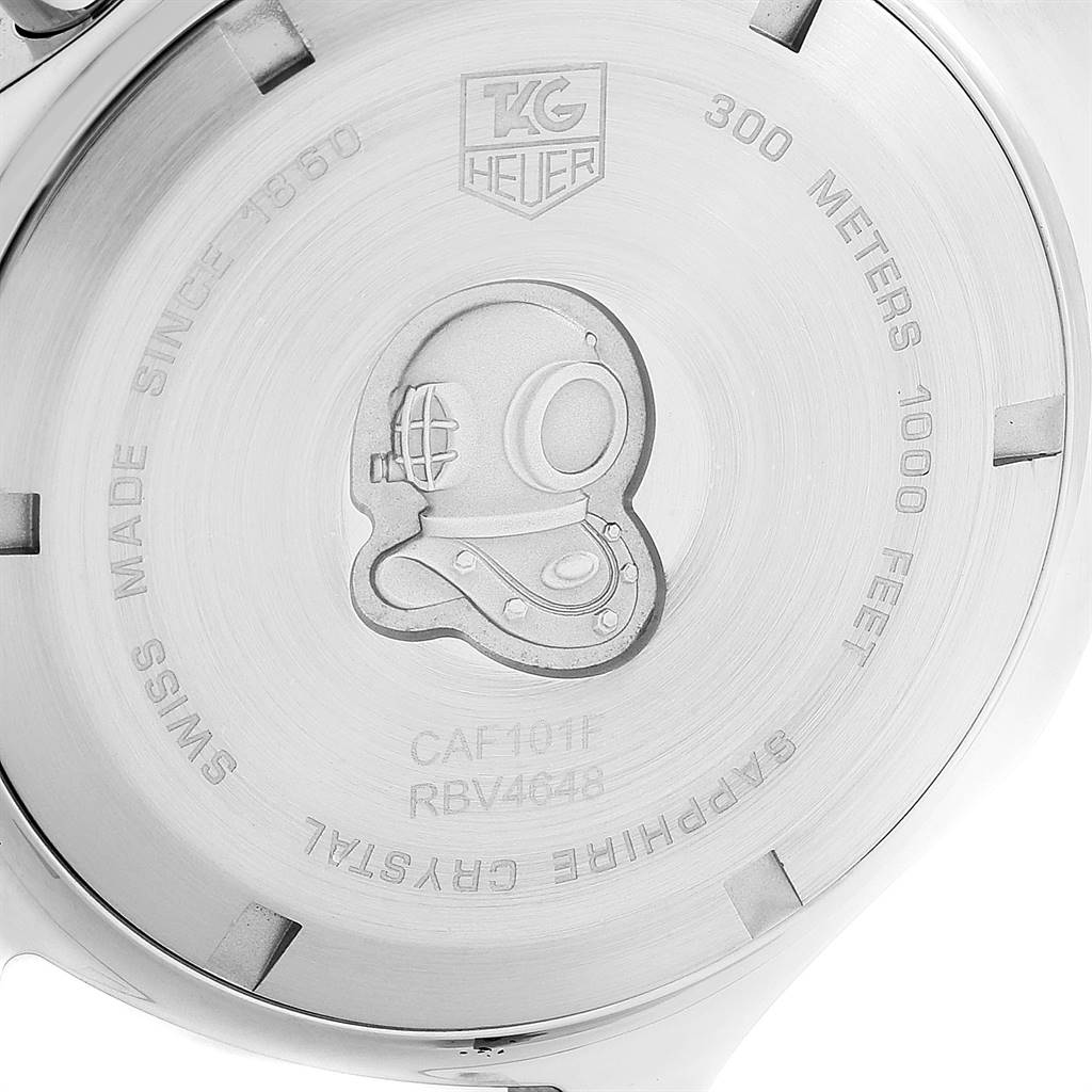 The image shows the case back of a Tag Heuer Aquaracer CAF101B.BA0821 Men's Stainless Steel Silver Dial CAF101B.BA0821 Men's Stainless Steel Silver Dial watch, featuring an engraved diver's helmet and brand markings.